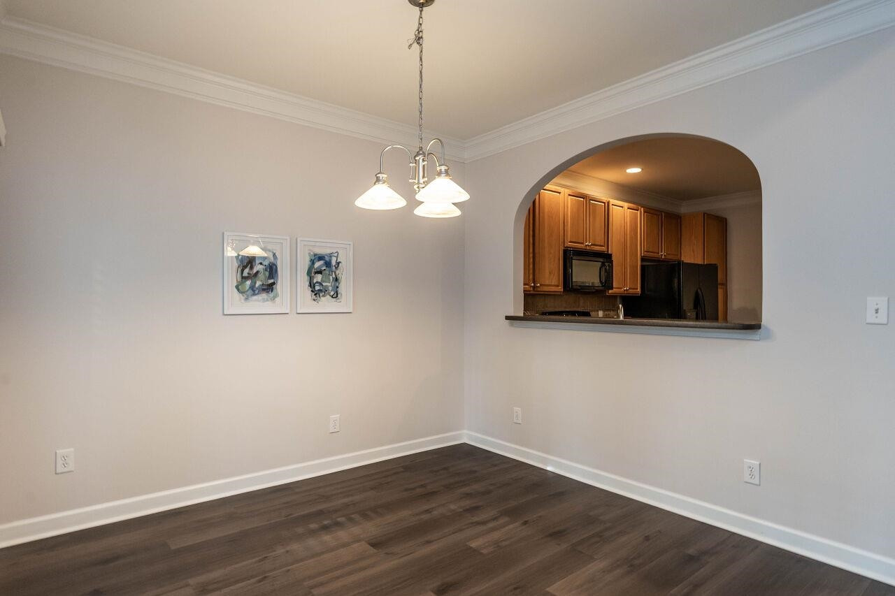5948 Kohler Lane Raleigh, NC 27616 - Photo 11 of 32 a view of a room with wooden floor and large windows