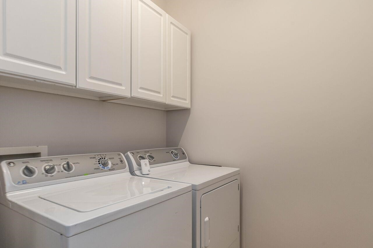 5948 Kohler Lane Raleigh, NC 27616 - Photo 18 of 32 a utility room with dryer and washer
