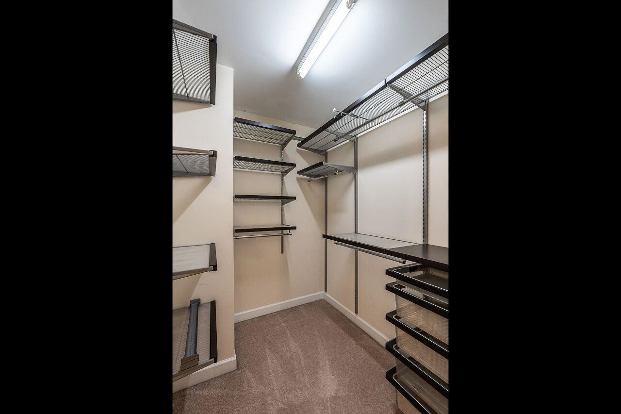 5948 Kohler Lane Raleigh, NC 27616 - Photo 24 of 32 a view of walk in closet with empty racks