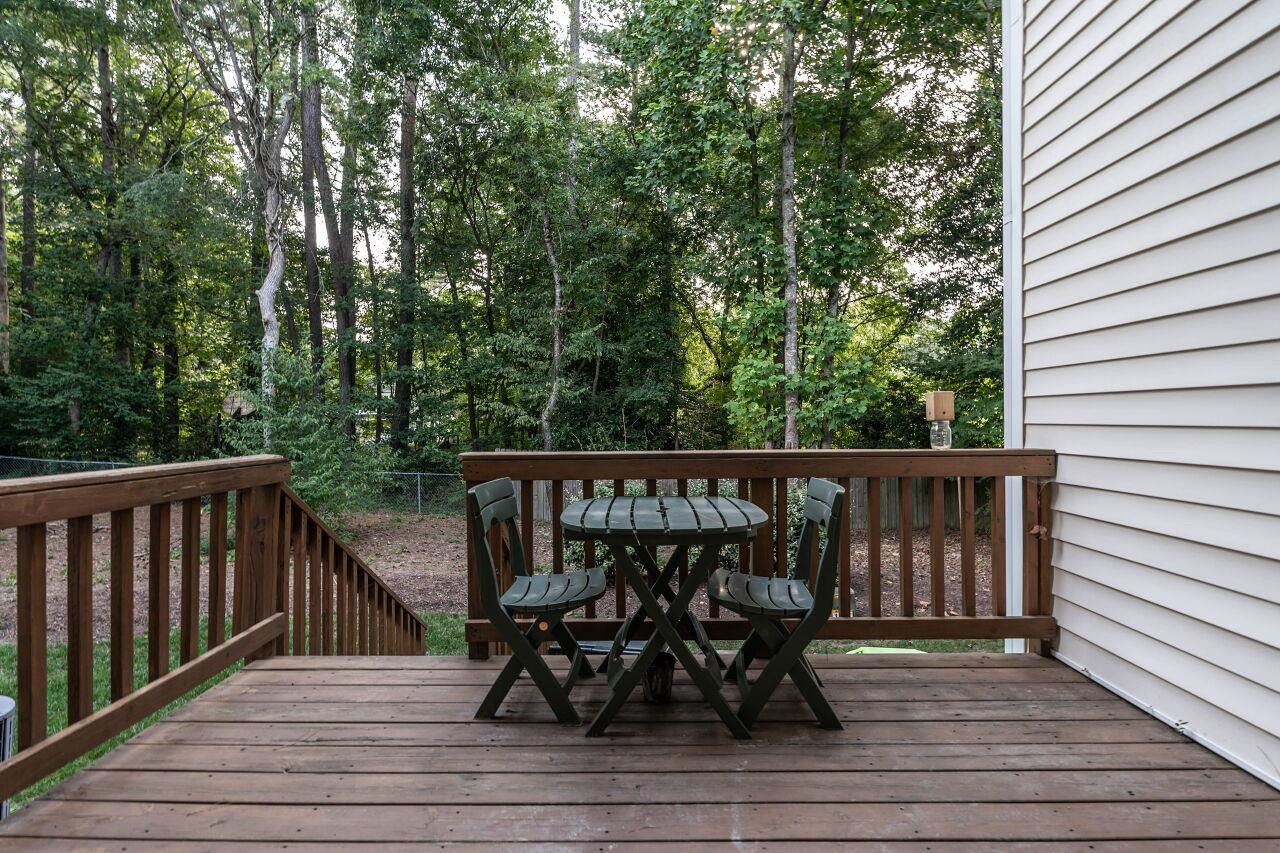 5948 Kohler Lane Raleigh, NC 27616 - Photo 29 of 32 a view of balcony with wooden floor and fence