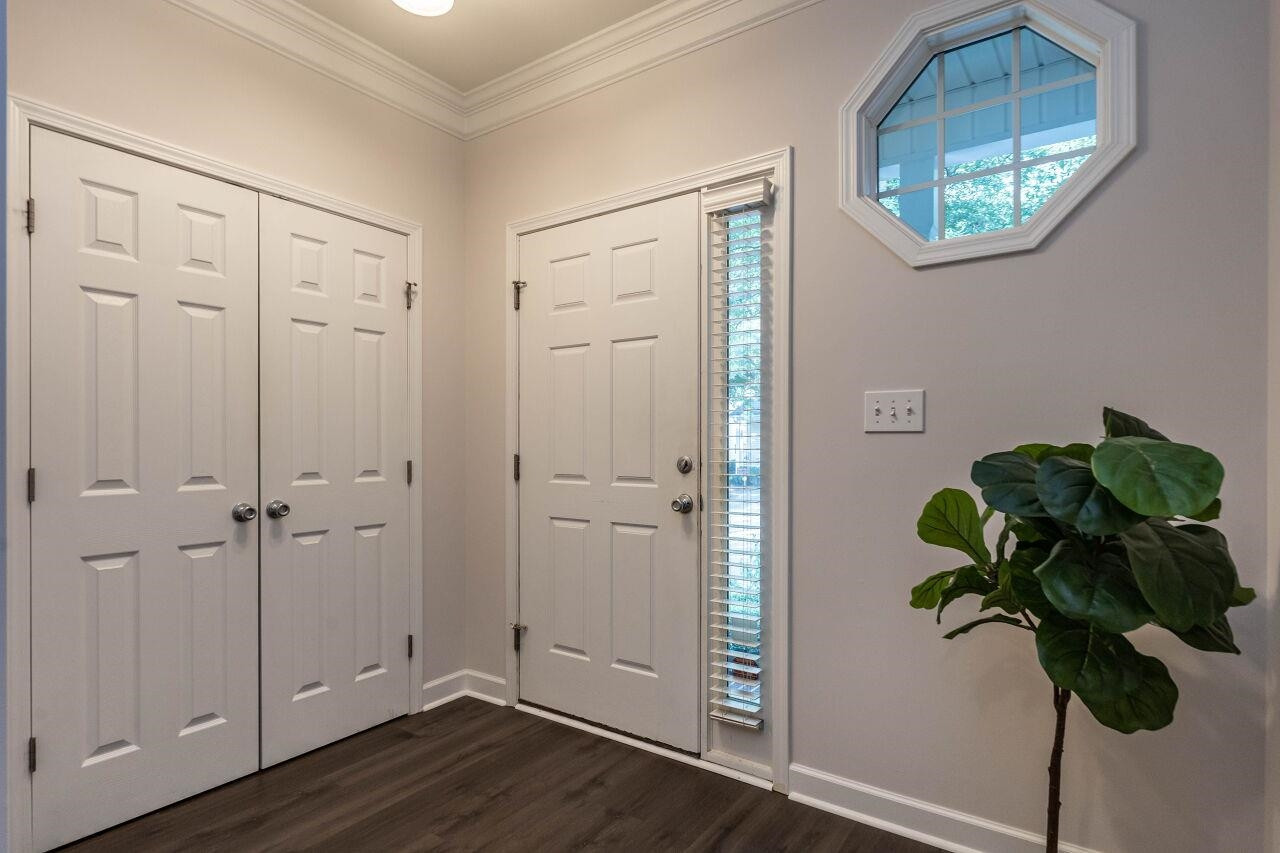 5948 Kohler Lane Raleigh, NC 27616 - Photo 4 of 32 a view of entryway with wooden floor