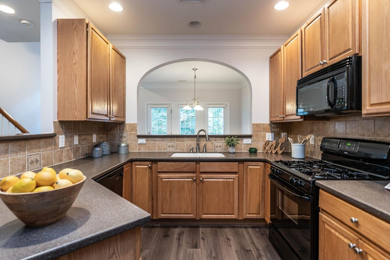 5948 Kohler Lane Raleigh, NC 27616 - Photo 6 of 32 a kitchen with a sink stove top oven and microwave