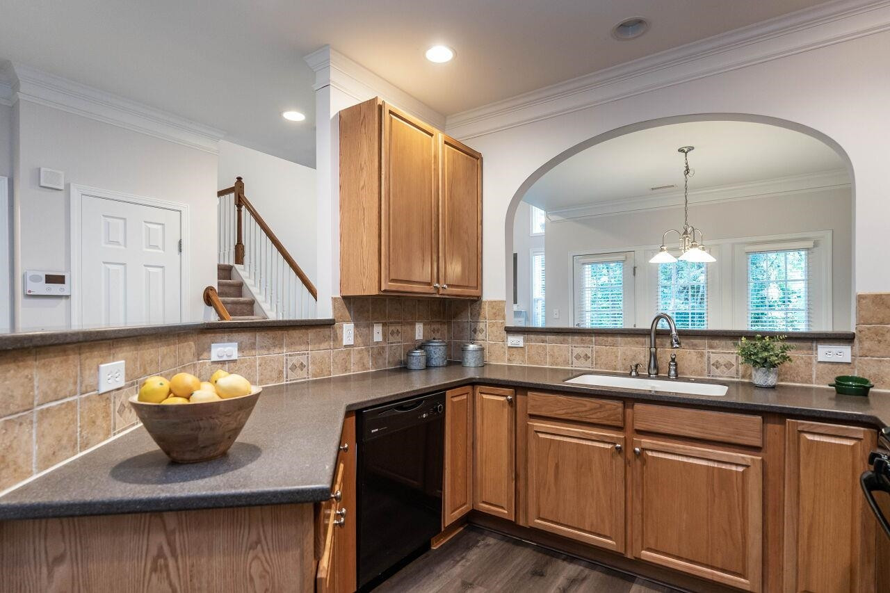 5948 Kohler Lane Raleigh, NC 27616 - Photo 8 of 32 a kitchen with a sink and cabinets