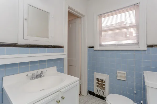 a bathroom with a sink and a toilet