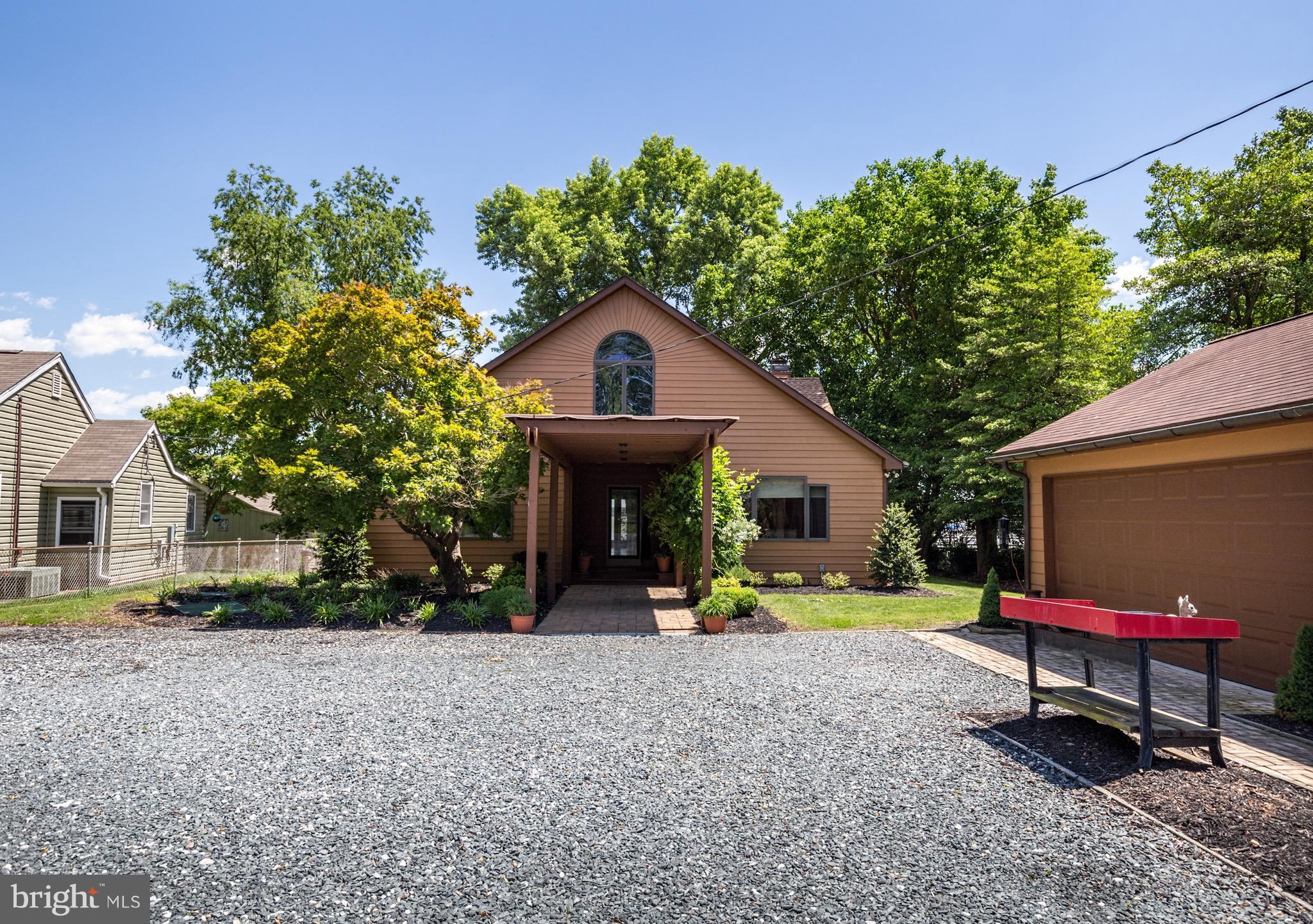 6702 Mallard Road Baltimore, MD 21220 - Photo 2 of 27 a view of house with outdoor seating area