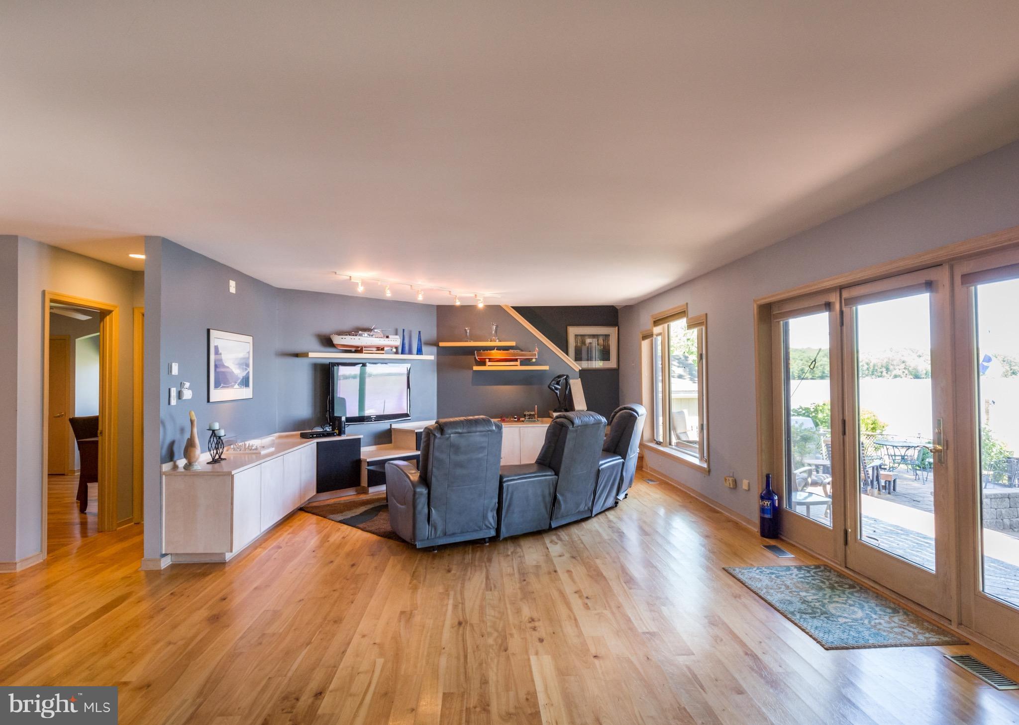 6702 Mallard Road Baltimore, MD 21220 - Photo 14 of 27 a living room with furniture and a wooden floor