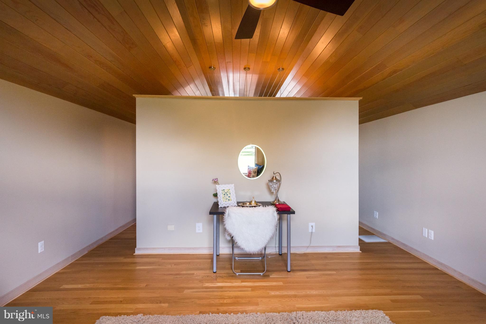 6702 Mallard Road Baltimore, MD 21220 - Photo 17 of 27 a view of a room with wooden floor table and chairs
