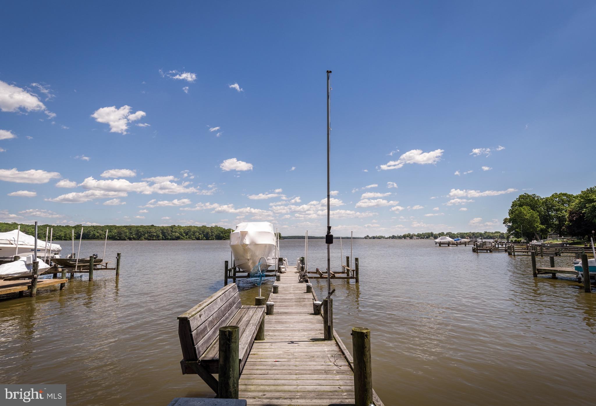 6702 Mallard Road Baltimore, MD 21220 - Photo 25 of 27 a view of a lake with boats and palm trees
