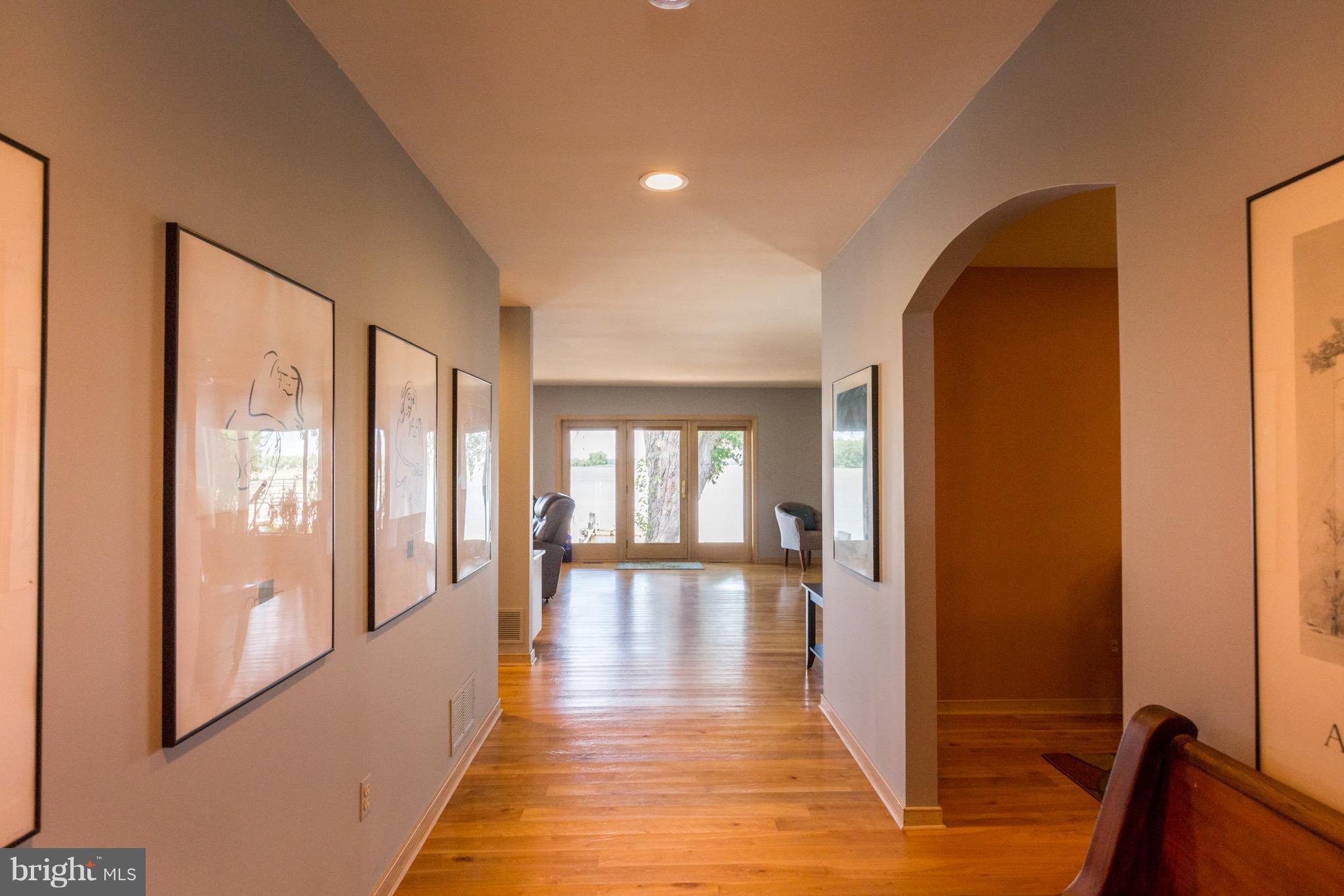 6702 Mallard Road Baltimore, MD 21220 - Photo 5 of 27 a view of a hallway with wooden floor and glass door