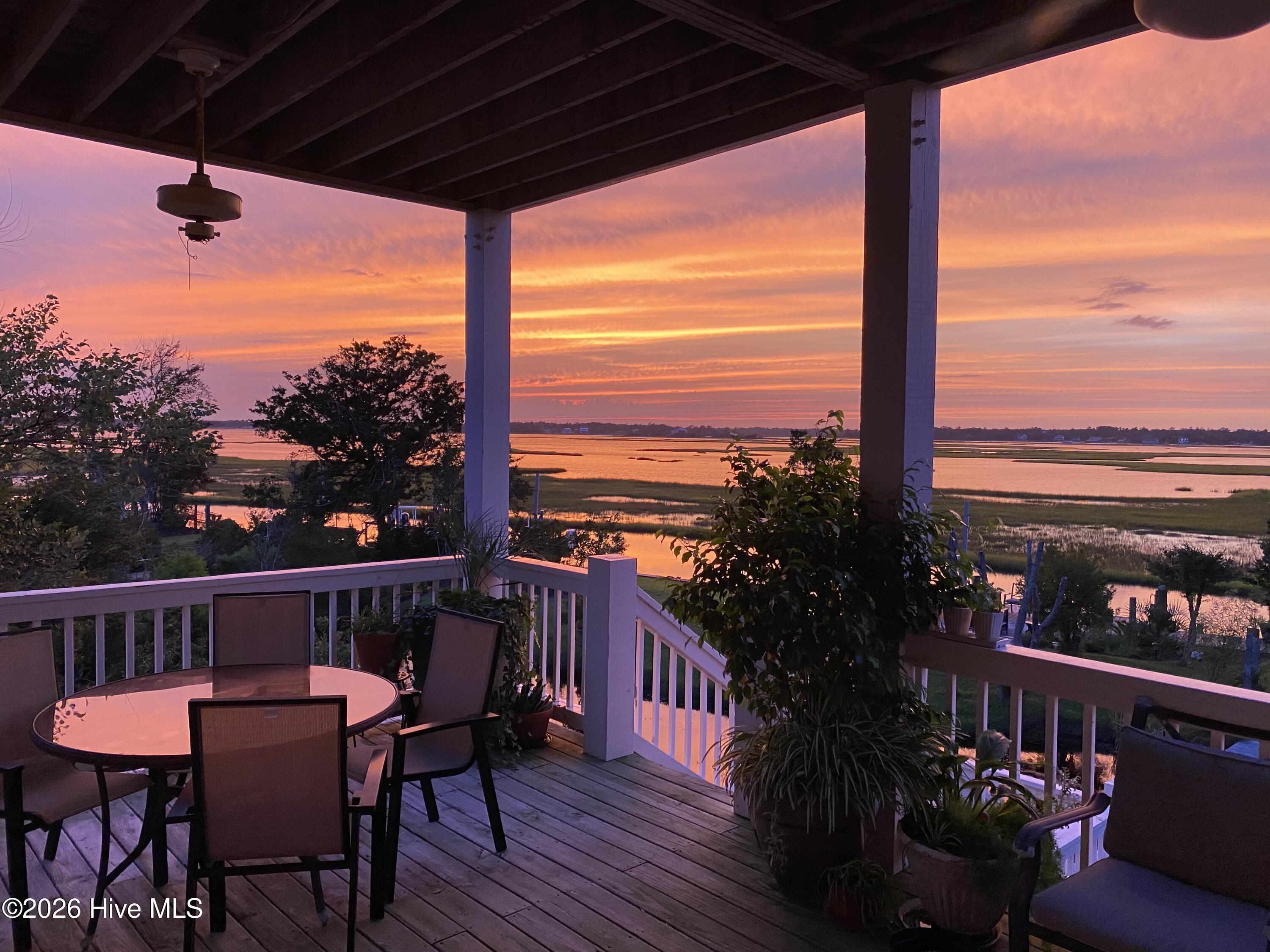 10 W Ridge Surf City, NC 28445 - Photo 55 of 86 pink sunset from 2nd level covered decking