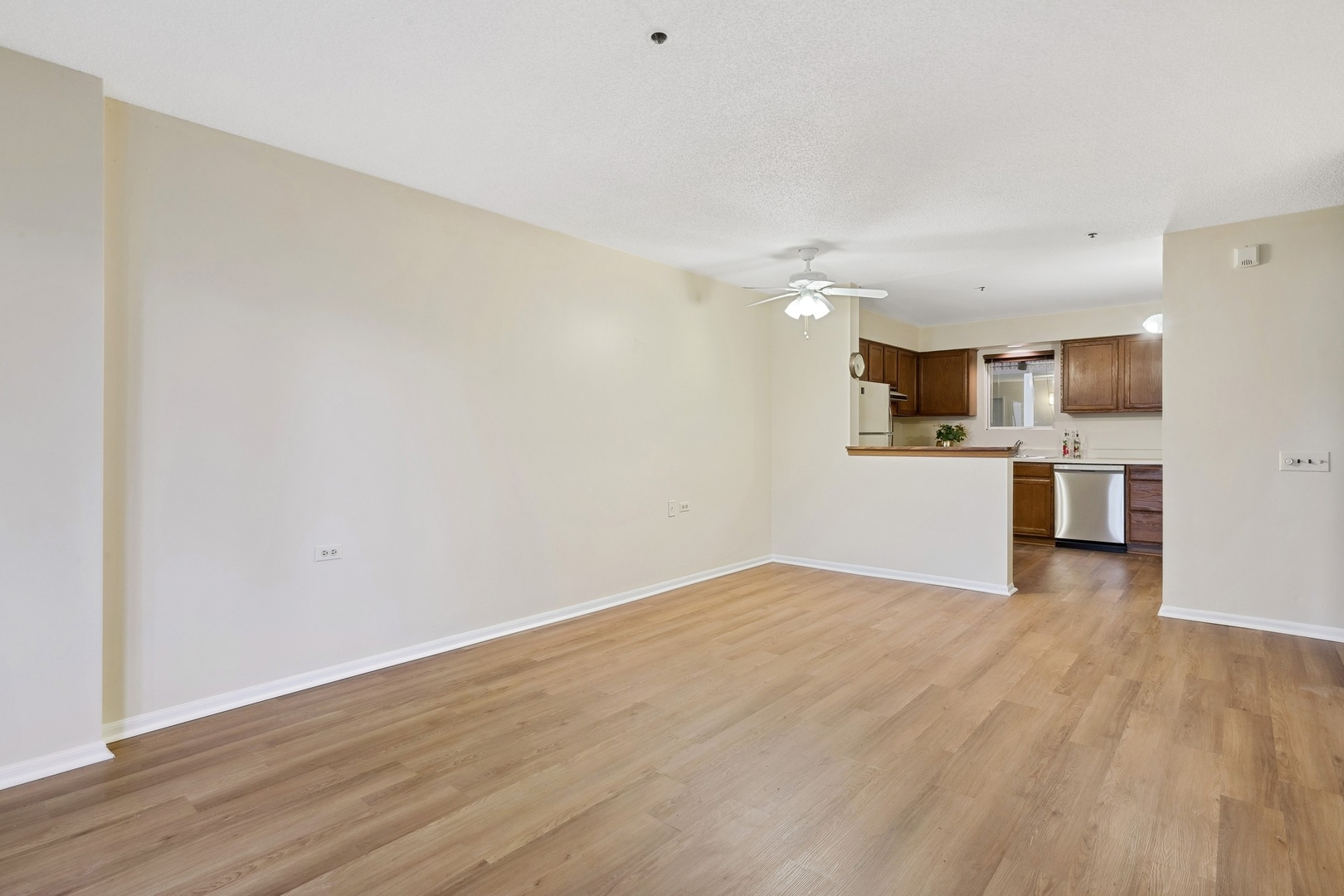 800 Ridge Road, Unit 103 Wilmette, IL 60091 - Photo 6 of 12 a view of a kitchen with a sink and a microwave