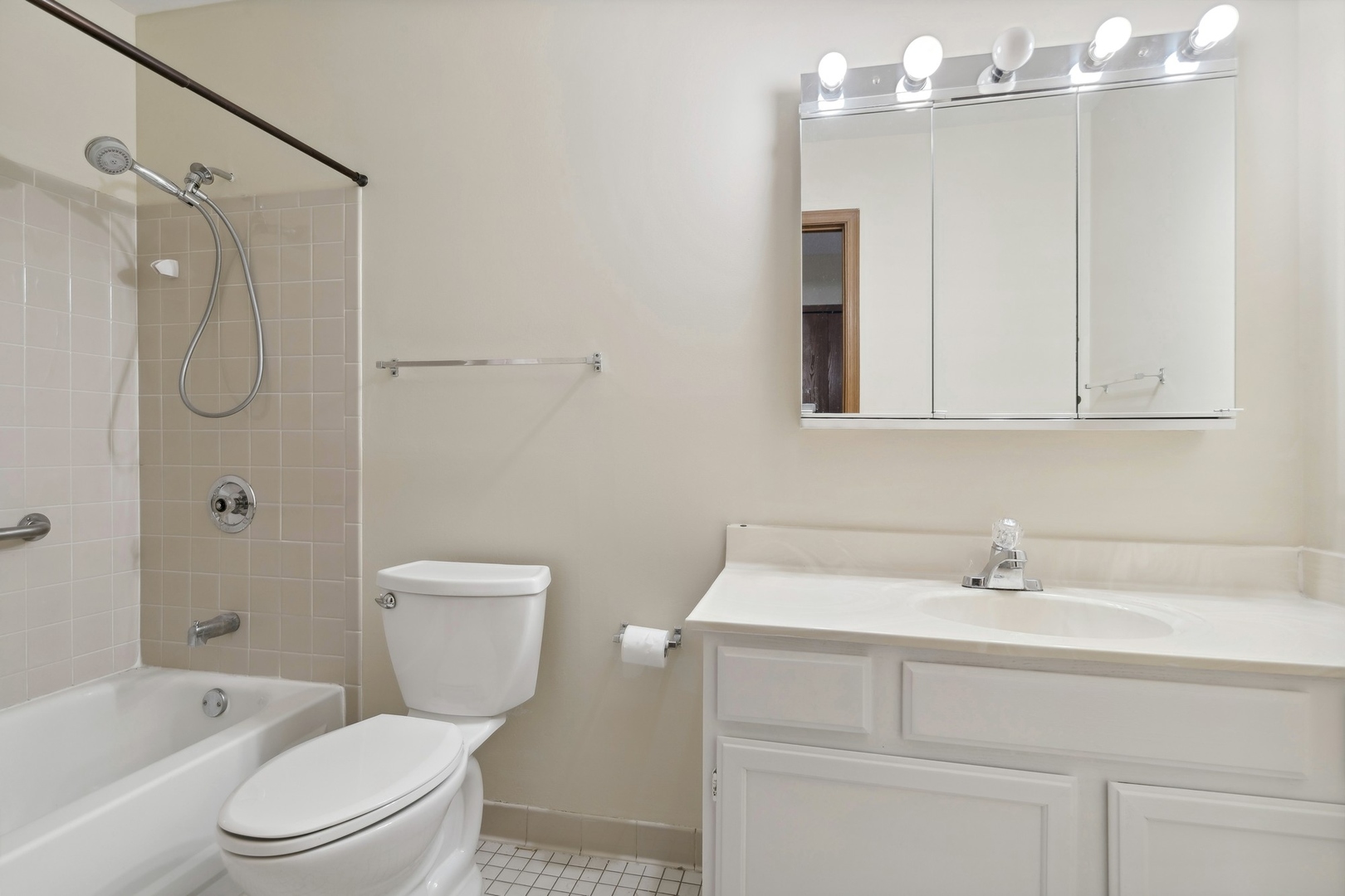 800 Ridge Road, Unit 103 Wilmette, IL 60091 - Photo 8 of 12 a bathroom with a sink a toilet and shower