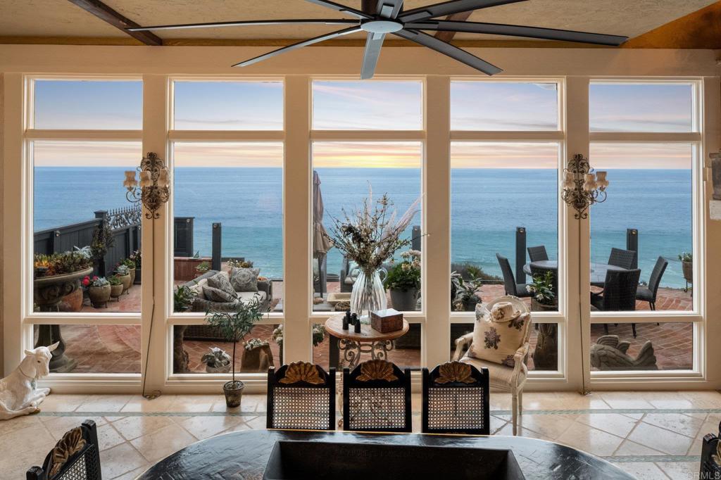 200 Neptune Avenue Encinitas, CA 92024 - Photo 12 of 33 a living room with furniture and floor to ceiling windows