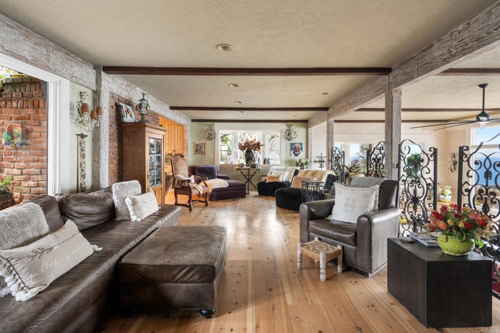 200 Neptune Avenue Encinitas, CA 92024 - Photo 16 of 33 a living room with furniture and a large window