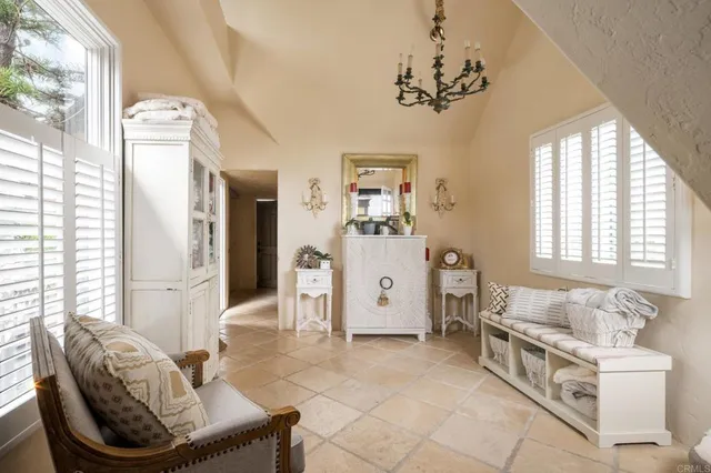 a bedroom with a bed ceiling fan and a window