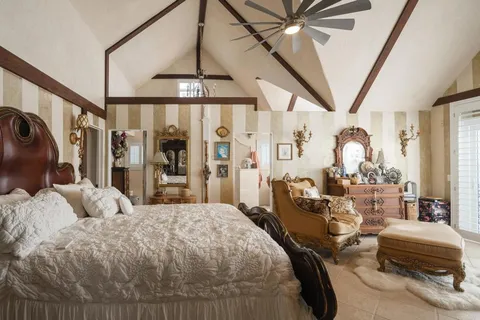 a bathroom with a granite countertop sink a mirror and shower