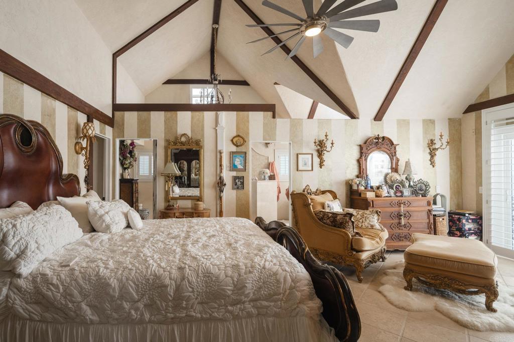 200 Neptune Avenue Encinitas, CA 92024 - Photo 24 of 33 a bedroom with a bed ceiling fan and a window