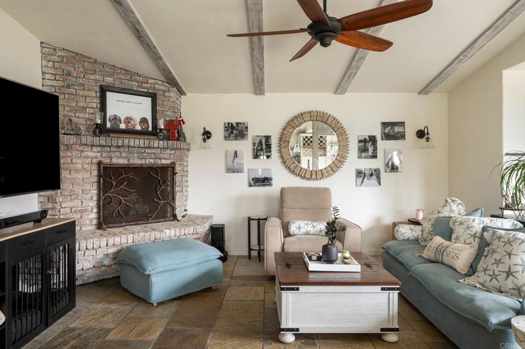 200 Neptune Avenue Encinitas, CA 92024 - Photo 31 of 33 a living room with furniture and a fireplace