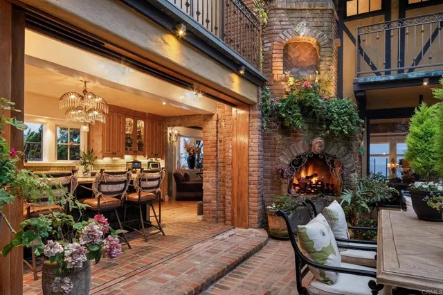 a view of a patio with table and chairs