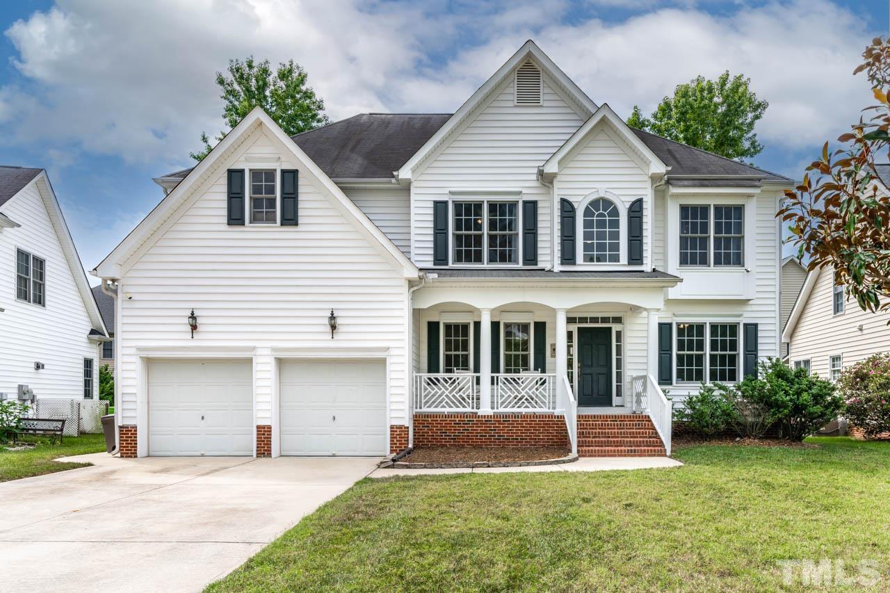 5906 Big Nance Drive Raleigh, NC 27616 - Photo 1 of 40 a front view of a house with a yard and potted plants