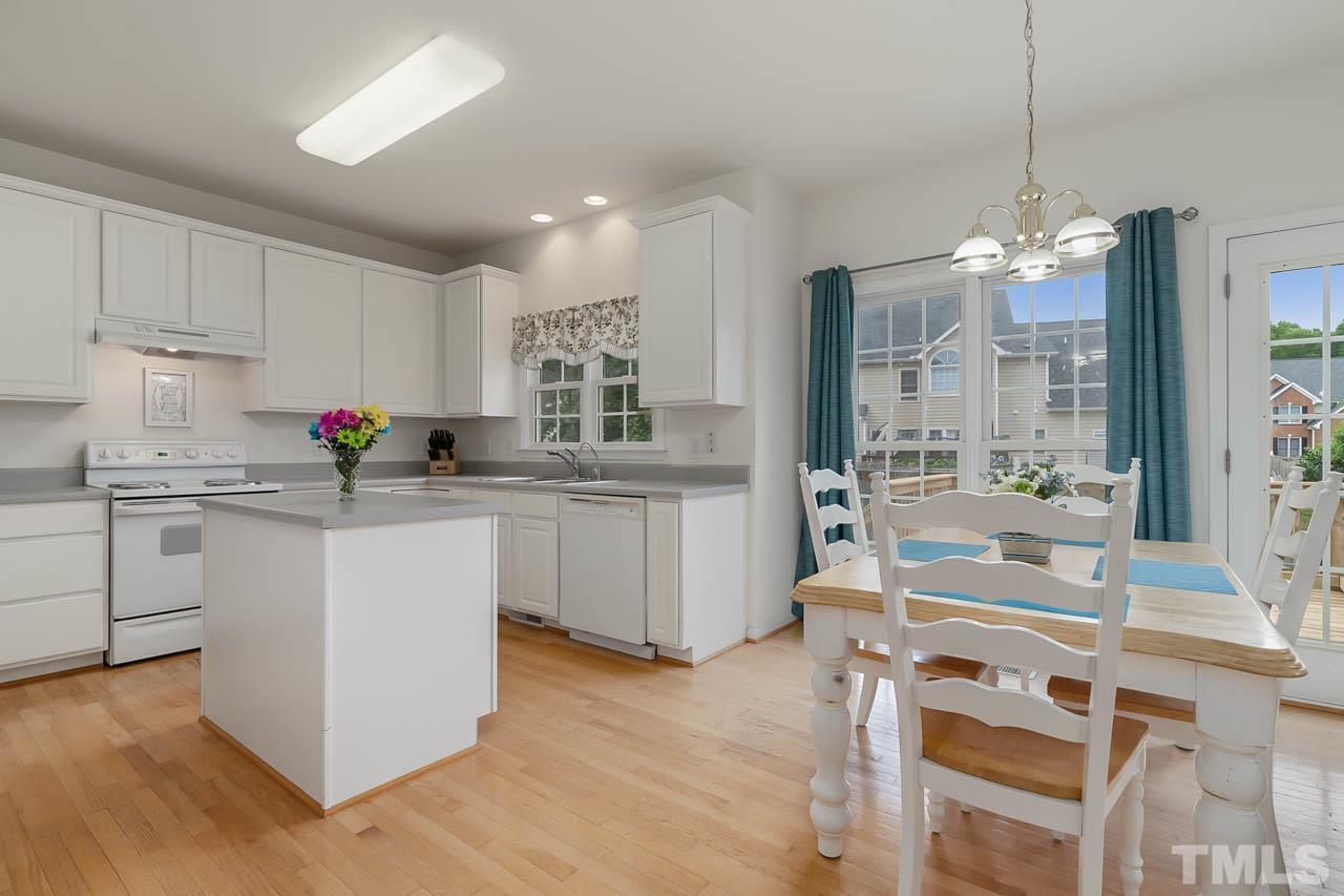 5906 Big Nance Drive Raleigh, NC 27616 - Photo 15 of 40 a kitchen with a sink cabinets and window