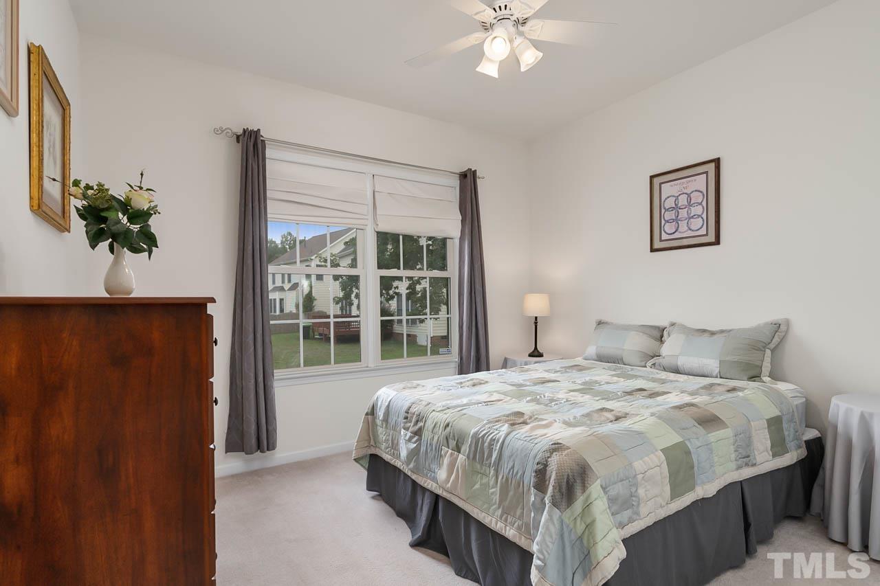 5906 Big Nance Drive Raleigh, NC 27616 - Photo 17 of 40 a spacious bedroom with a bed and a window
