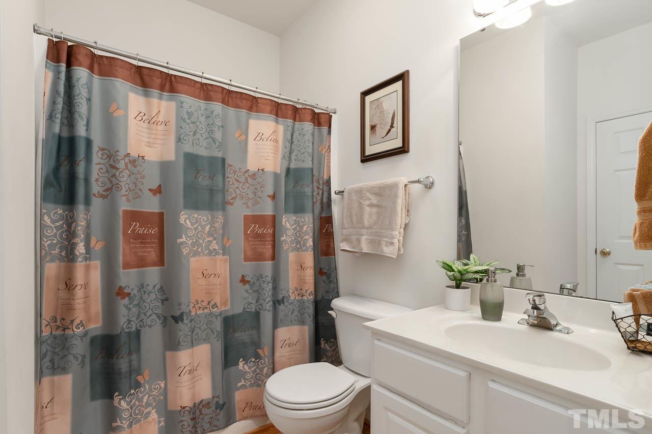 5906 Big Nance Drive Raleigh, NC 27616 - Photo 18 of 40 a bathroom with a sink toilet and shower