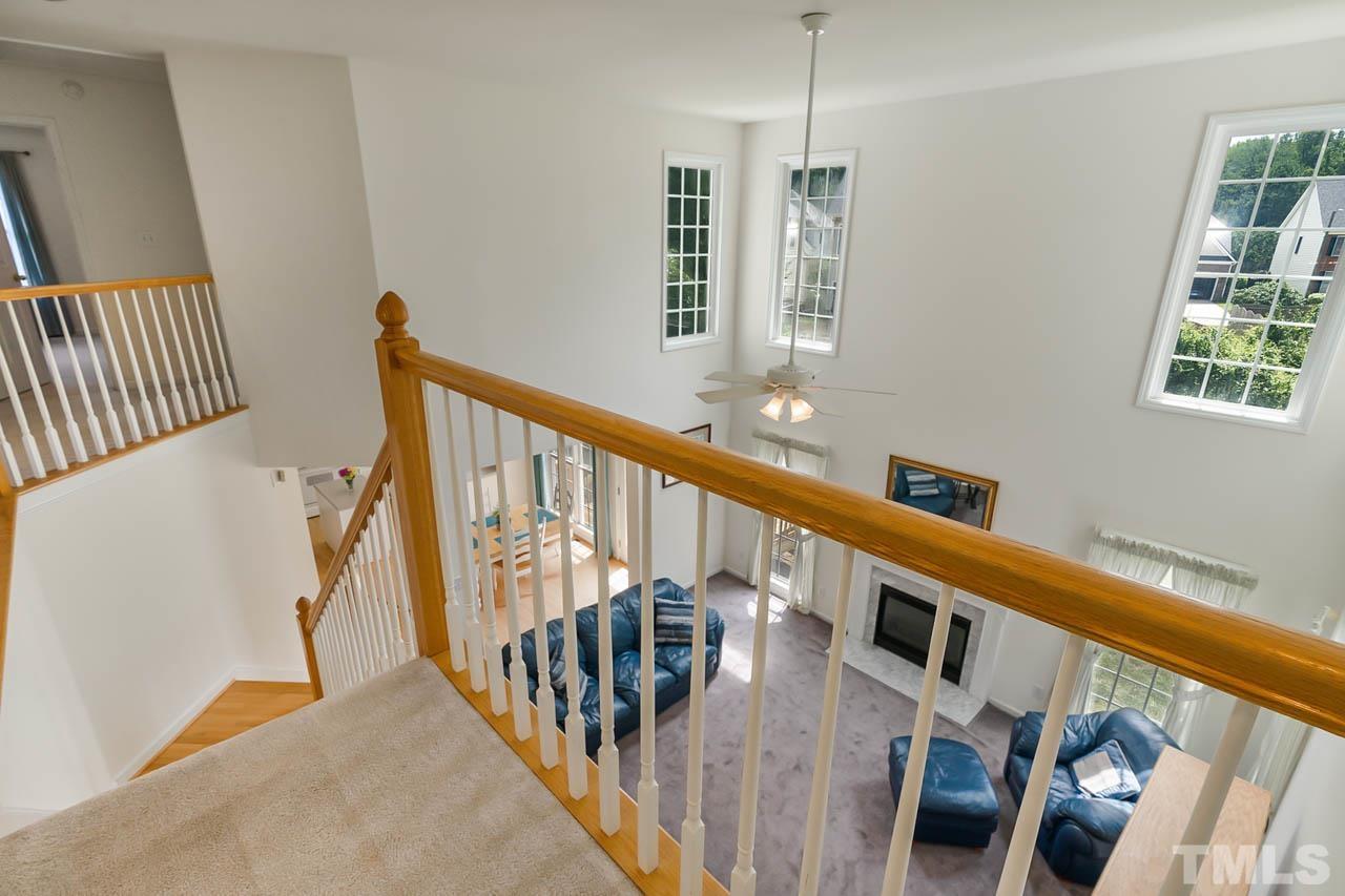 5906 Big Nance Drive Raleigh, NC 27616 - Photo 19 of 40 a view of an entryway wooden floor and stairs