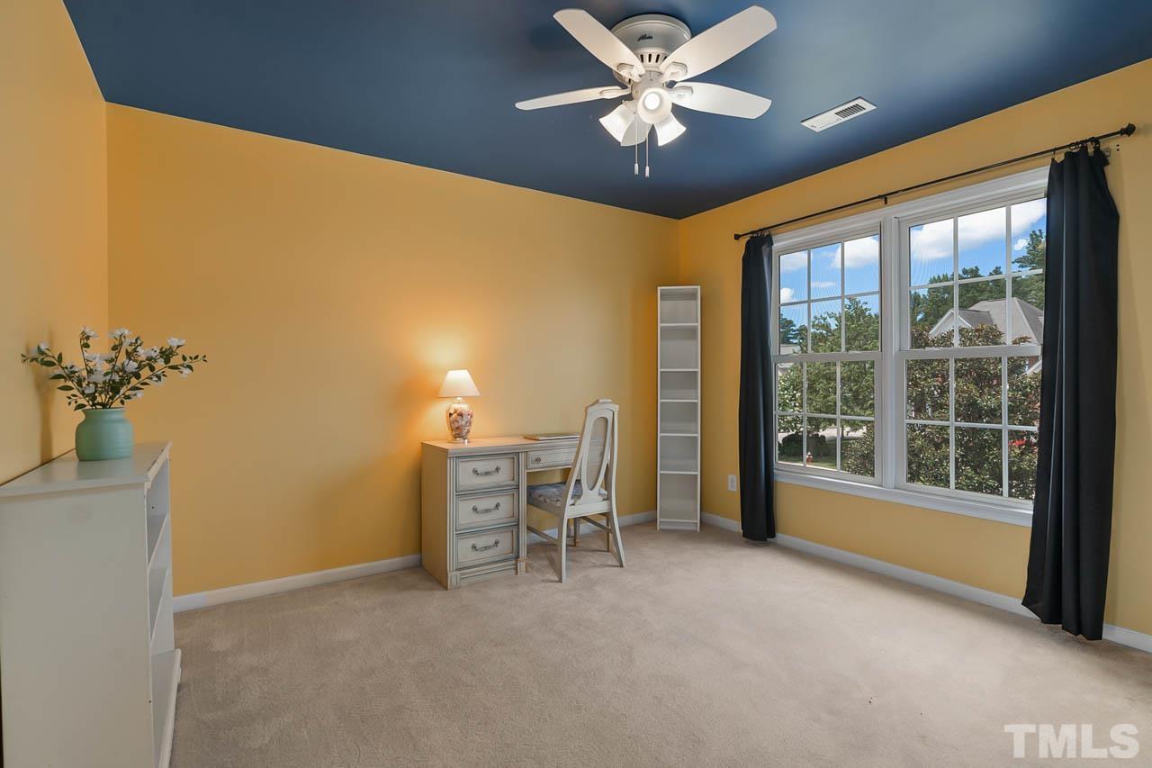 5906 Big Nance Drive Raleigh, NC 27616 - Photo 22 of 40 a view of a livingroom with furniture and a ceiling fan