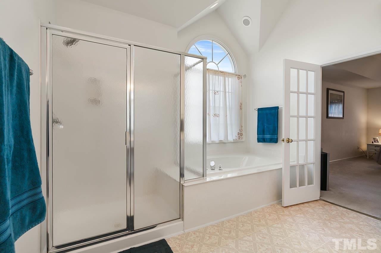 5906 Big Nance Drive Raleigh, NC 27616 - Photo 29 of 40 a bathroom with a bathtub and a shower