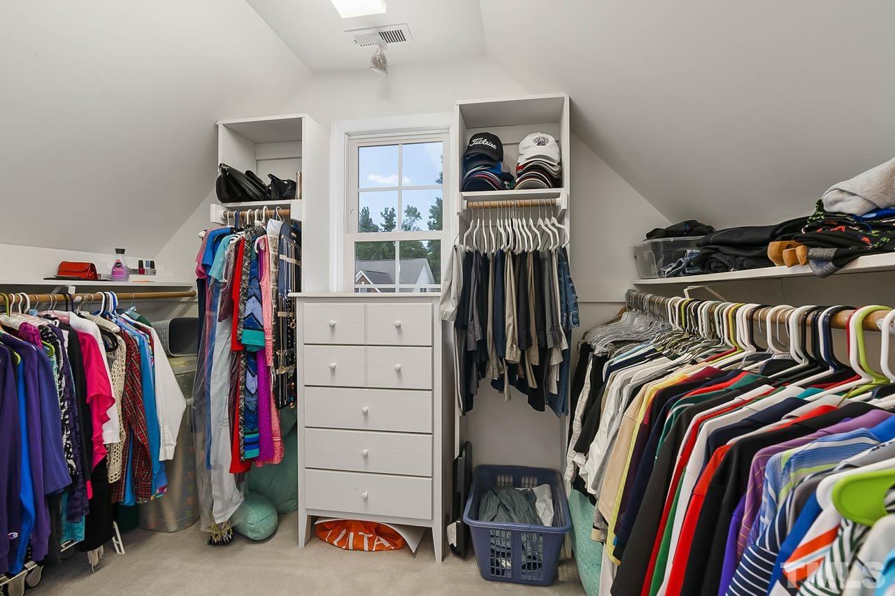 5906 Big Nance Drive Raleigh, NC 27616 - Photo 30 of 40 a view of walk in closet with clothes and shoes