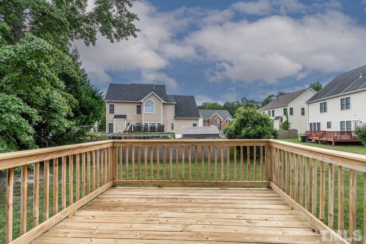 5906 Big Nance Drive Raleigh, NC 27616 - Photo 32 of 40 a view of a house with a wooden deck