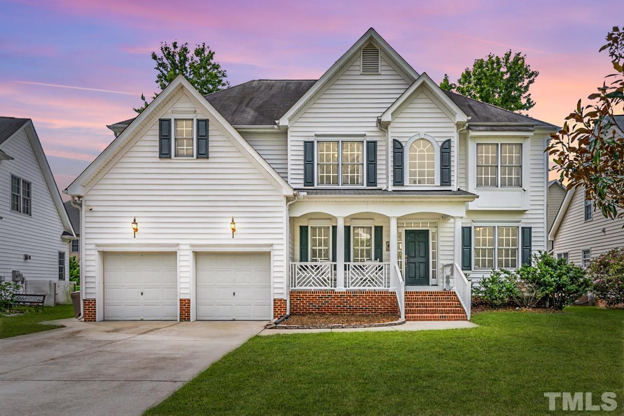 5906 Big Nance Drive Raleigh, NC 27616 - Photo 40 of 40 a front view of a house with a yard and porch