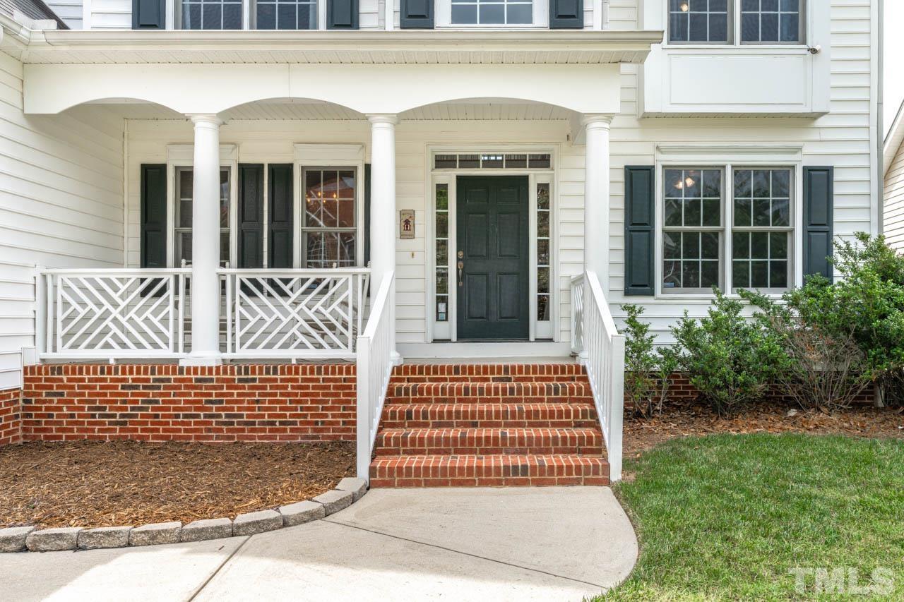 5906 Big Nance Drive Raleigh, NC 27616 - Photo 4 of 40 a front view of a house with a garden