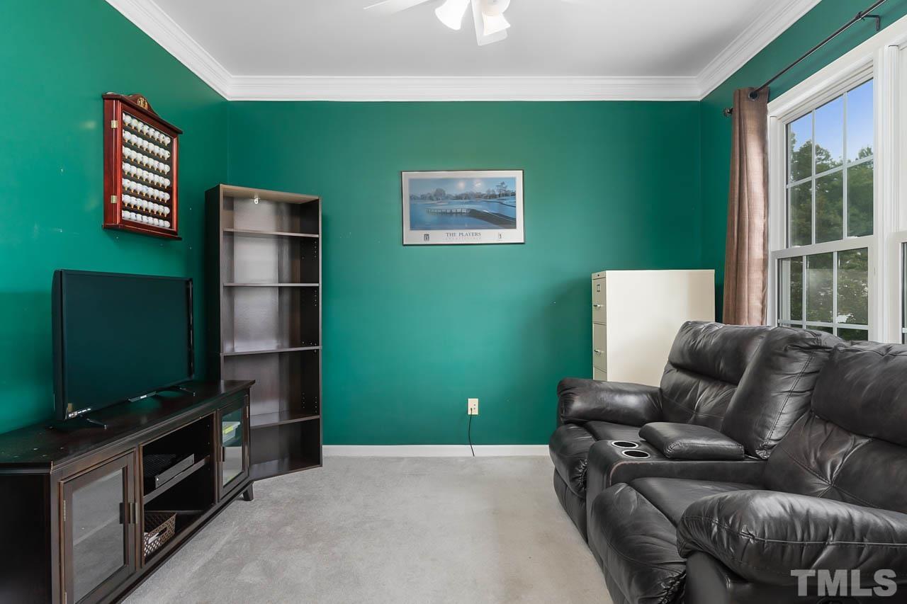 5906 Big Nance Drive Raleigh, NC 27616 - Photo 7 of 40 a living room with furniture and a flat screen tv