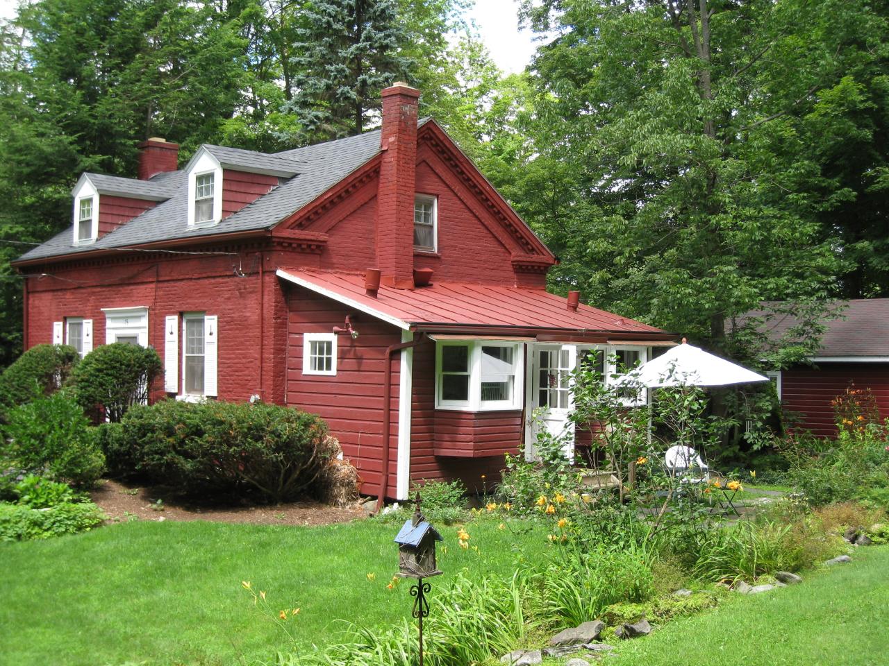 115 West Center Road West Stockbridge, MA 01266 - Photo 2 of 19 a front view of a house with a yard
