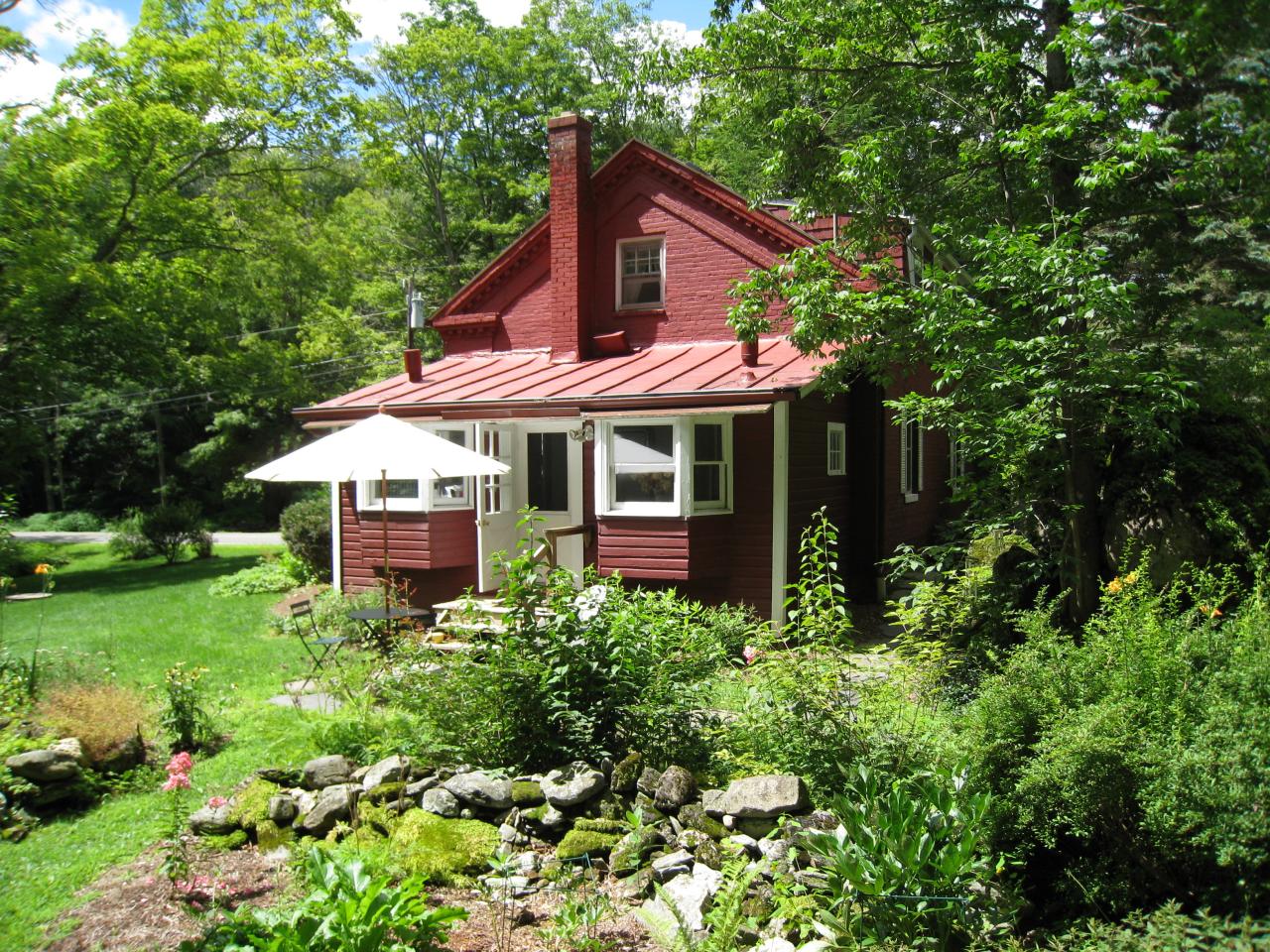 115 West Center Road West Stockbridge, MA 01266 - Photo 17 of 19 a view of a house with a yard and garden