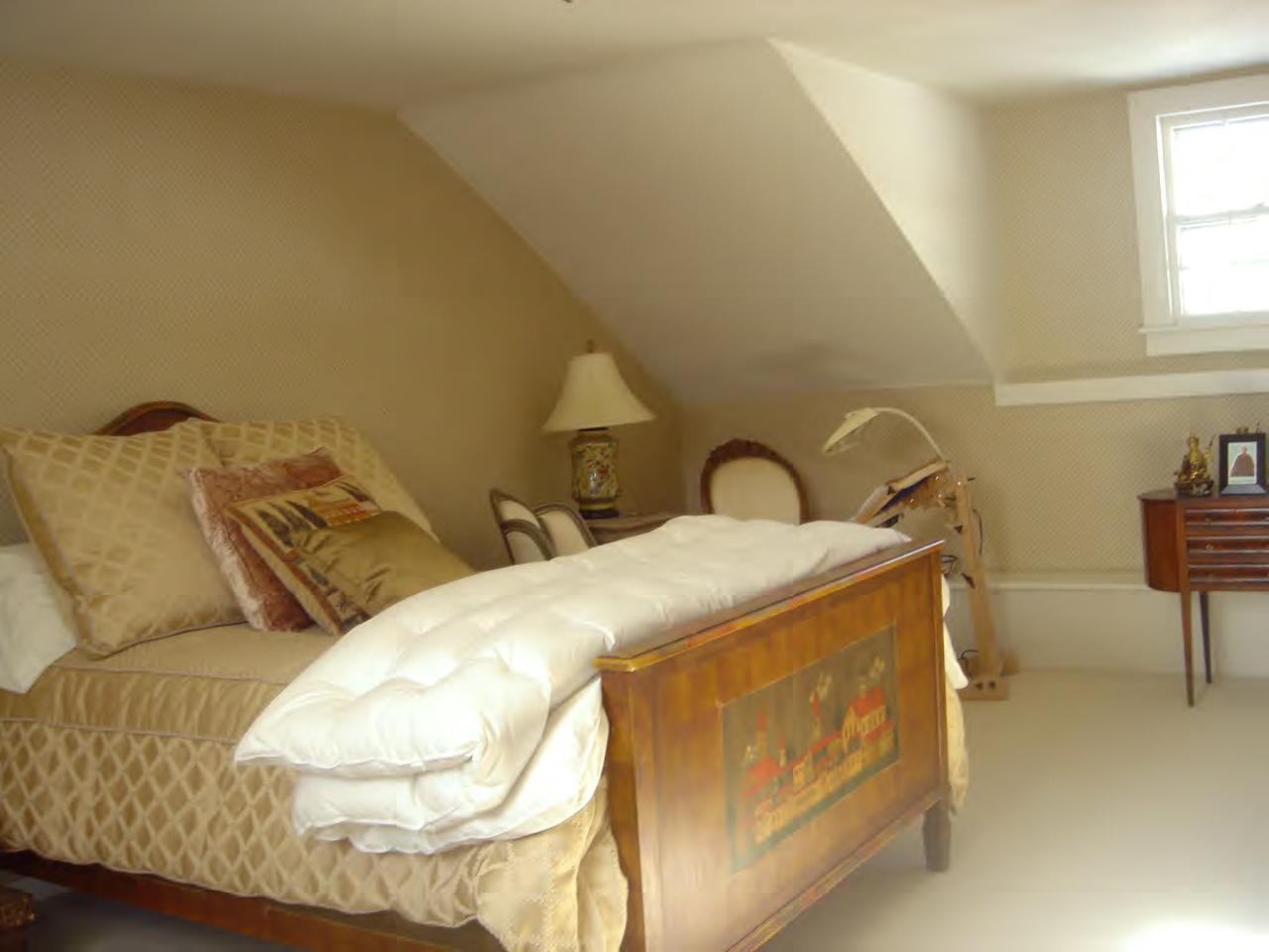 115 West Center Road West Stockbridge, MA 01266 - Photo 10 of 19 a bed sitting in a bedroom next to a window