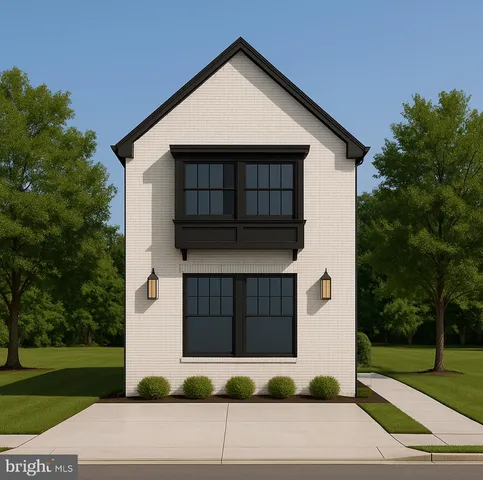 a front view of a house with garage and yard