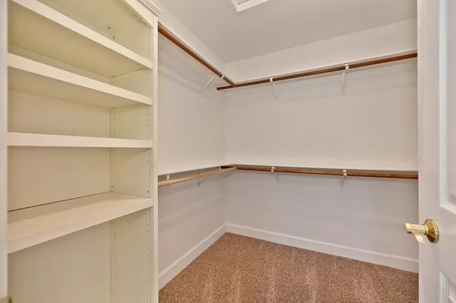 a view of an empty walk in closet