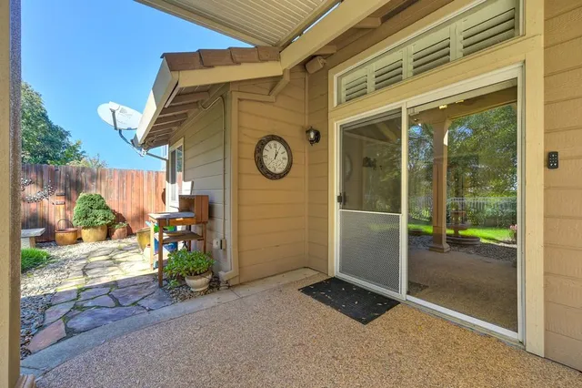 a view of small house with a outdoor space