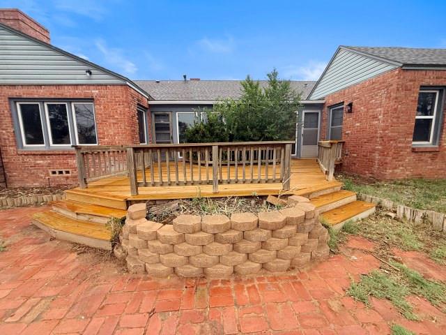 1001 North 3rd Street Lamesa, TX 79331 - Photo 6 of 32 a view of a house with backyard and deck
