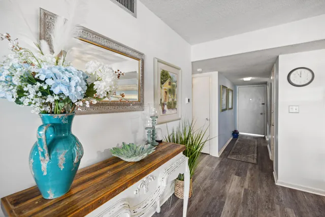 a view of a living room and wooden floor