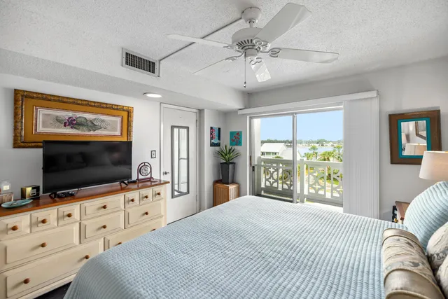 a bedroom with furniture and flat screen tv