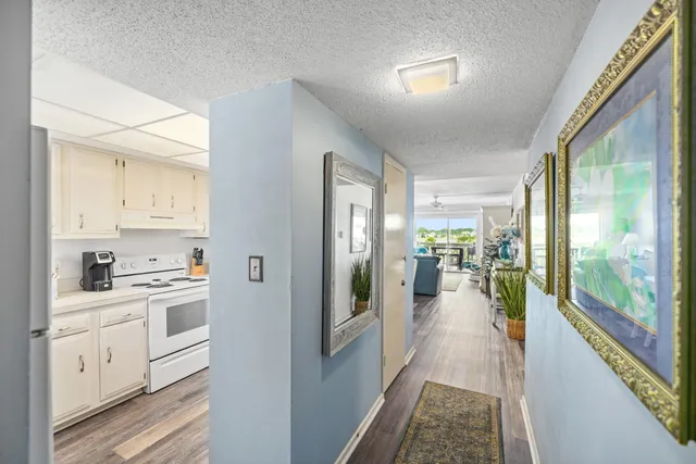 a view of a kitchen with a stove top oven