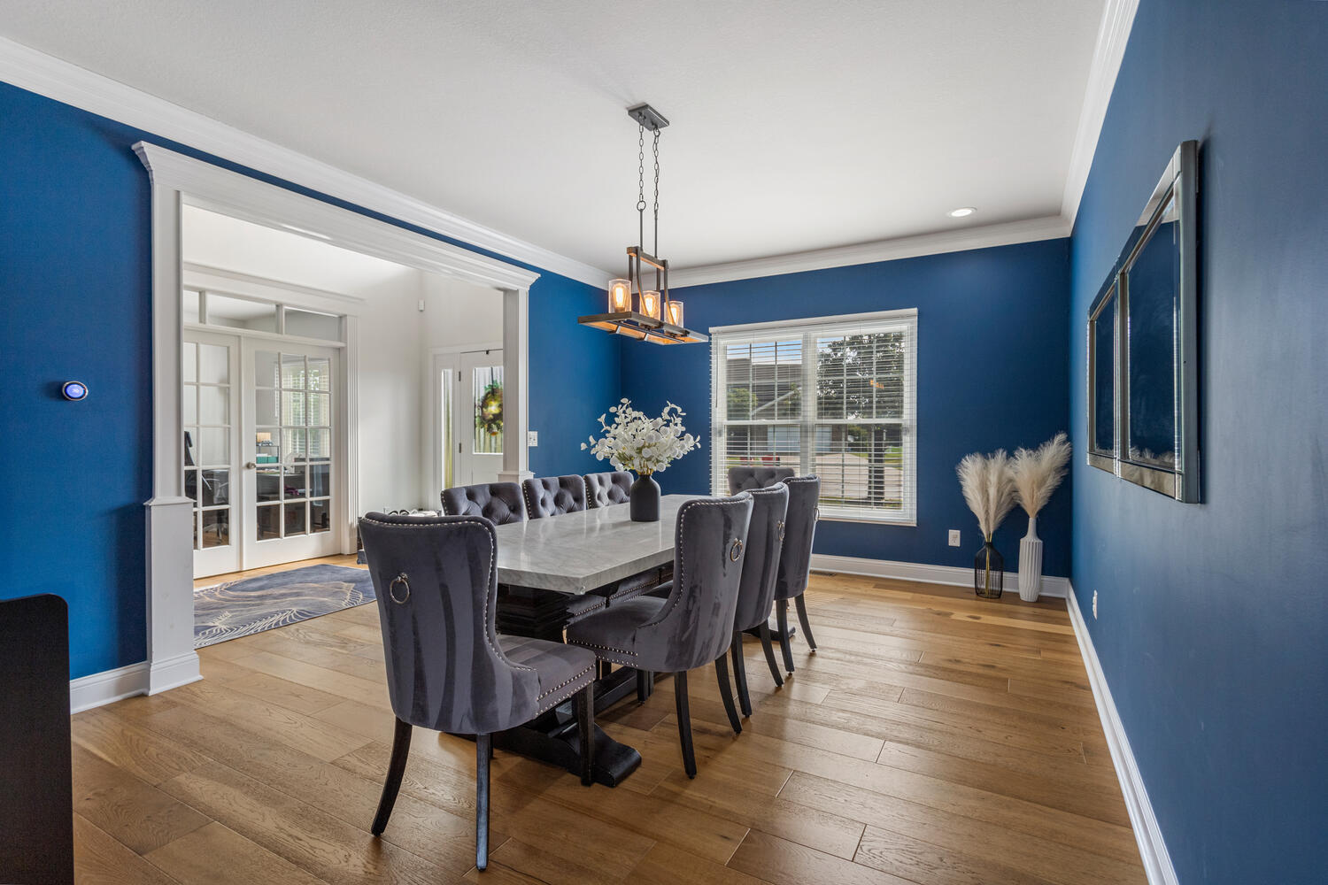 1621 English Oak Drive Champaign, IL 61822 - Photo 20 of 62 a dining room with furniture a chandelier and wooden floor