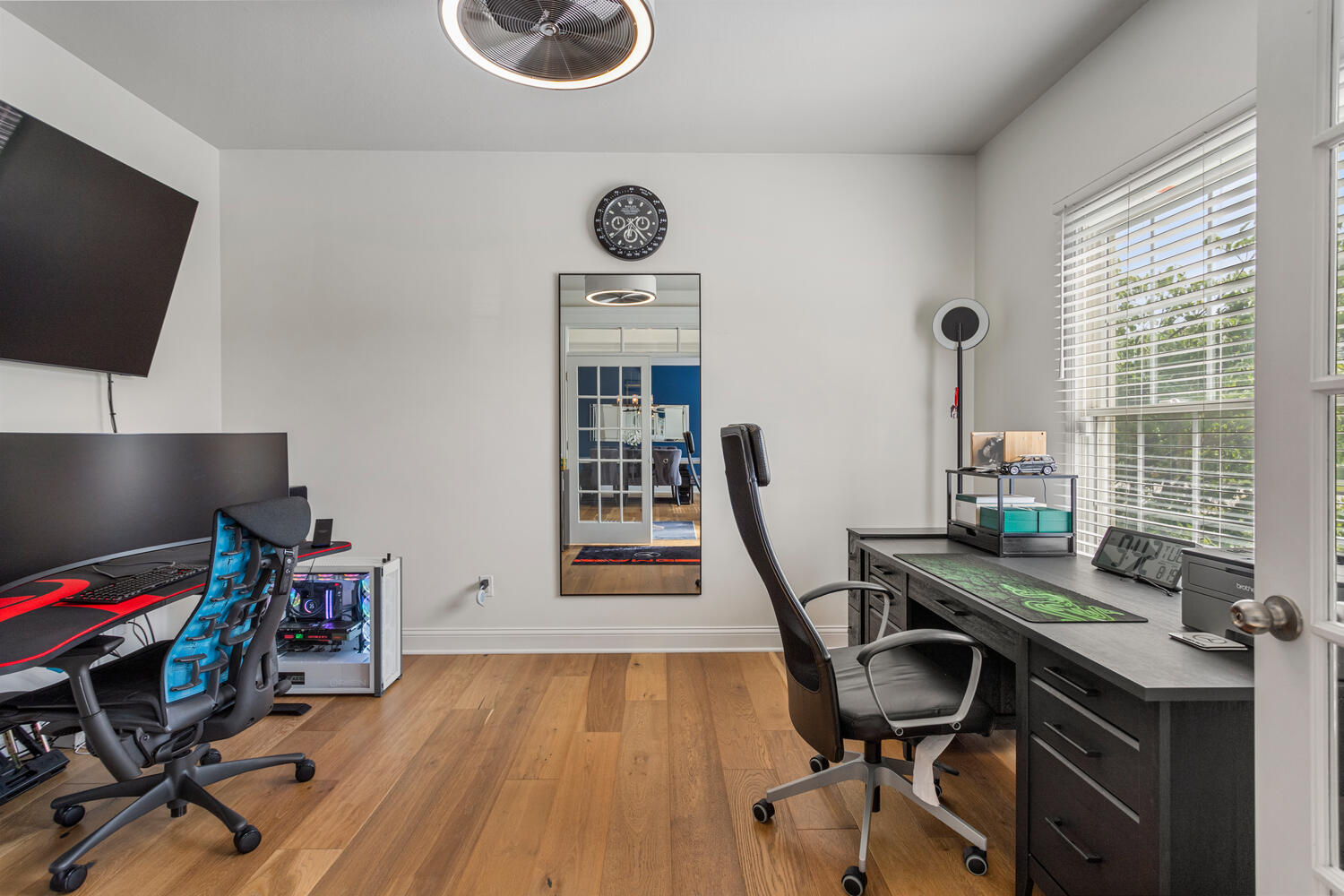 1621 English Oak Drive Champaign, IL 61822 - Photo 21 of 62 a view of a workspace with furniture and a flat screen tv