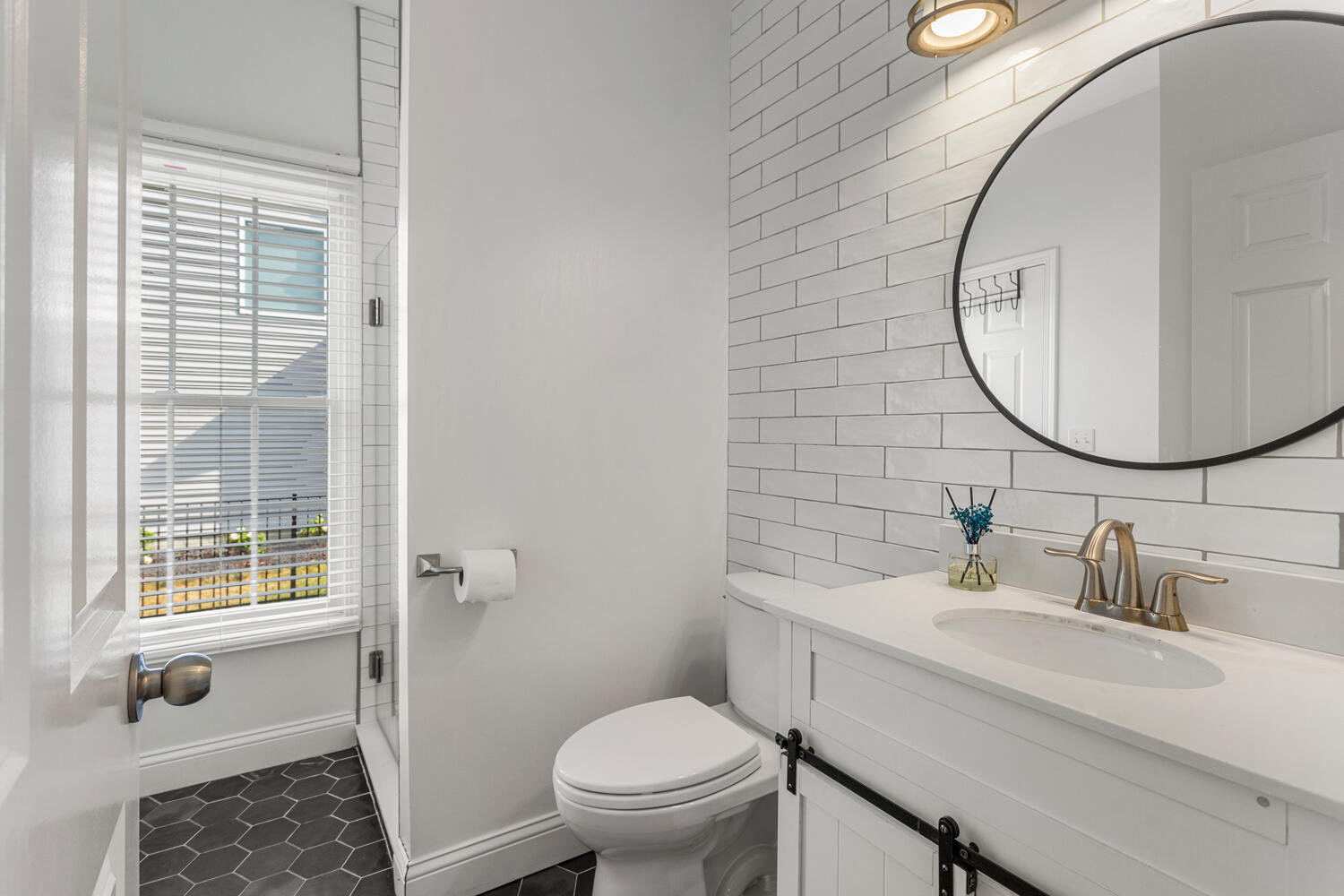 1621 English Oak Drive Champaign, IL 61822 - Photo 24 of 62 a bathroom with a sink a toilet and a mirror