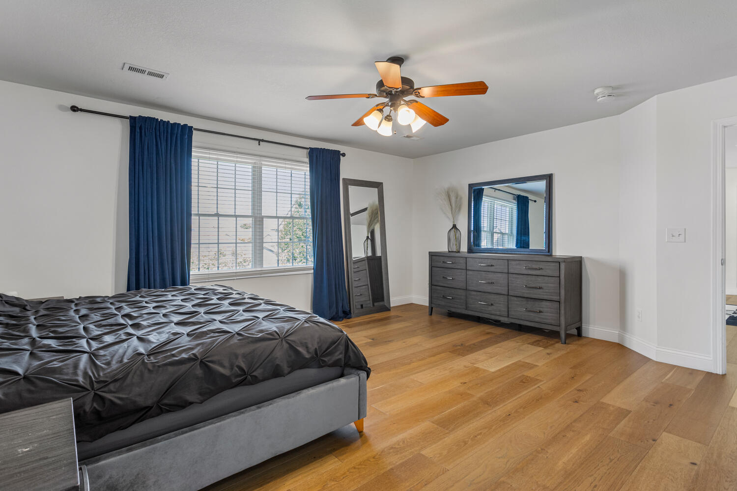 1621 English Oak Drive Champaign, IL 61822 - Photo 27 of 62 a bedroom with a large bed and a chandelier