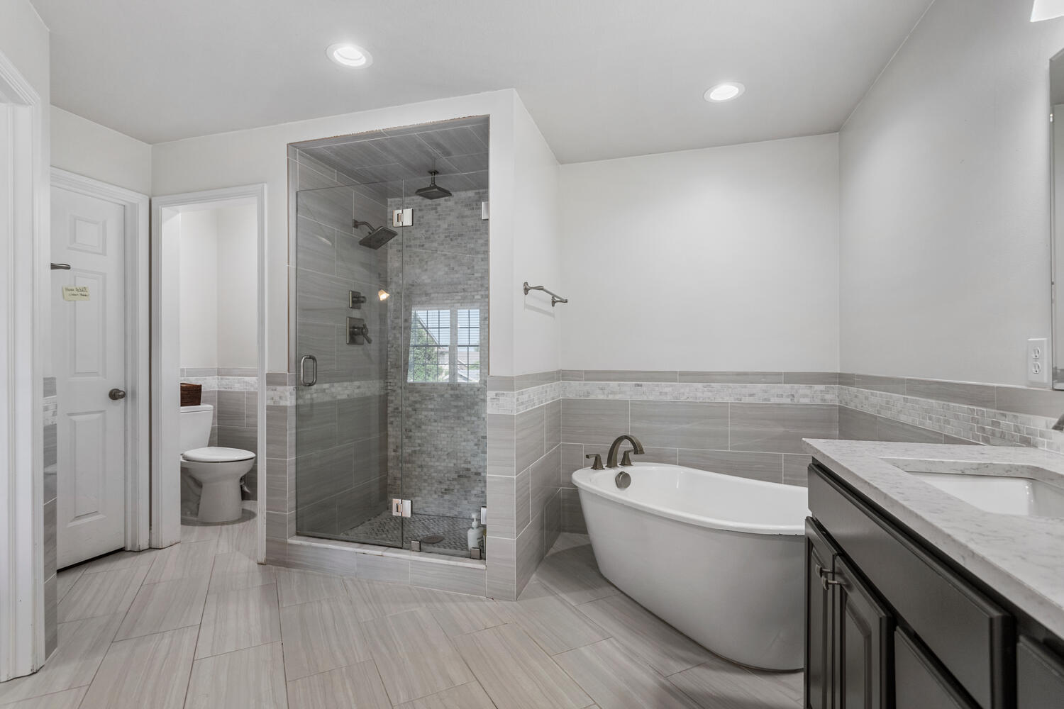 1621 English Oak Drive Champaign, IL 61822 - Photo 29 of 62 a bathroom with a granite countertop sink a toilet a mirror and shower